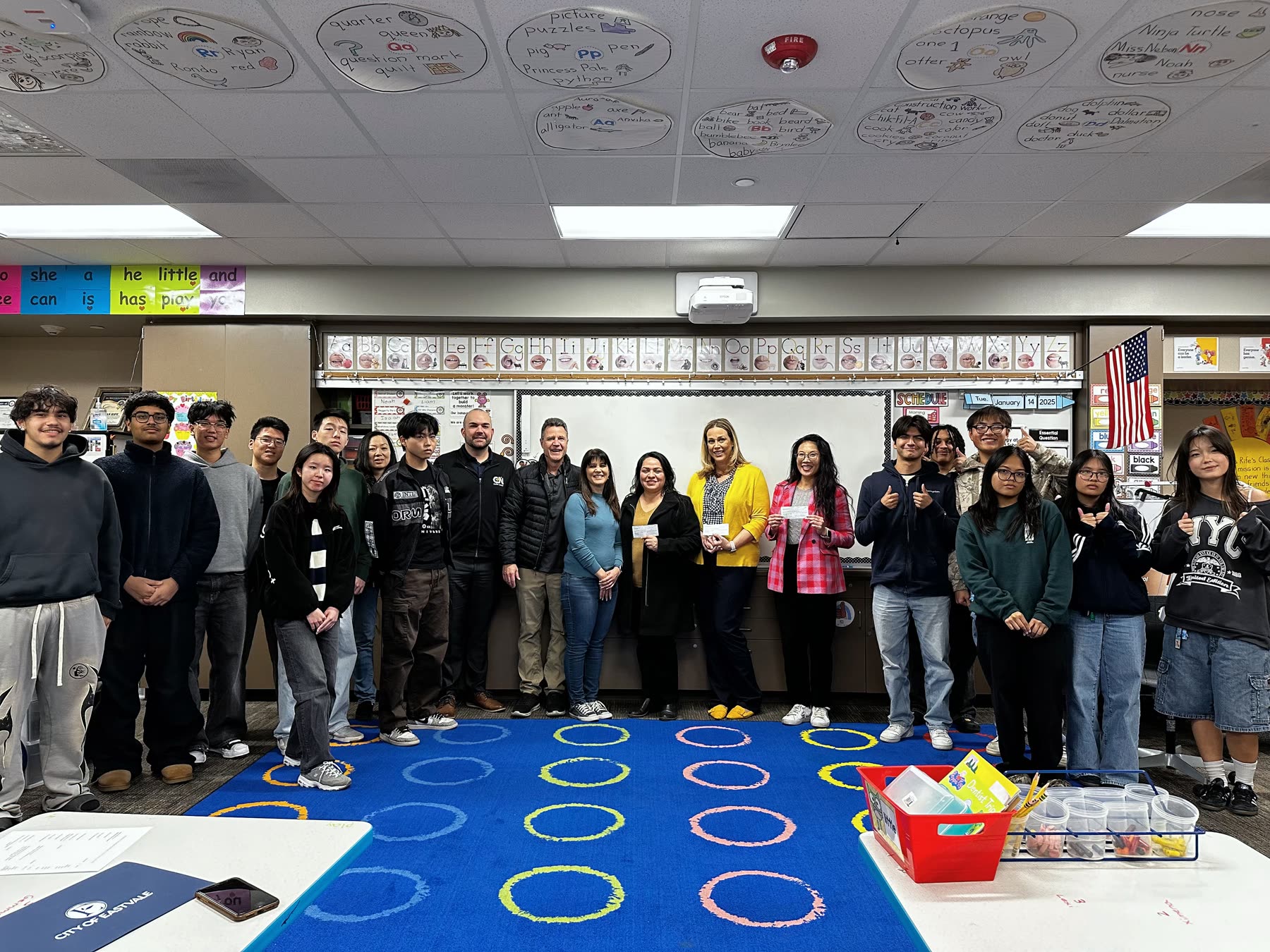 Chris with students and community members during a classroom visit.