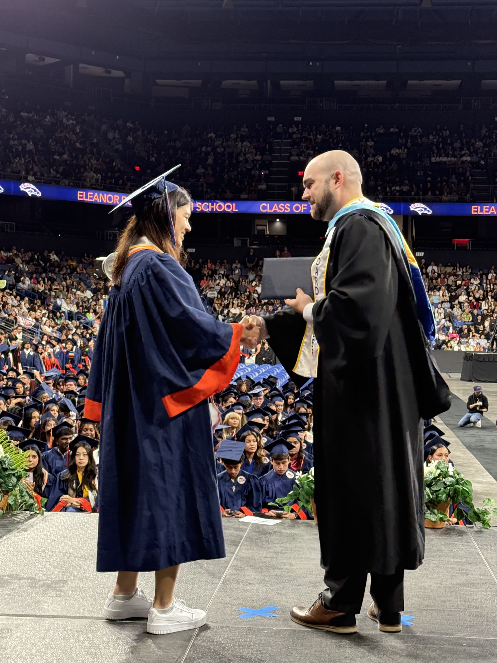 Chris congratulating a student at graduation.