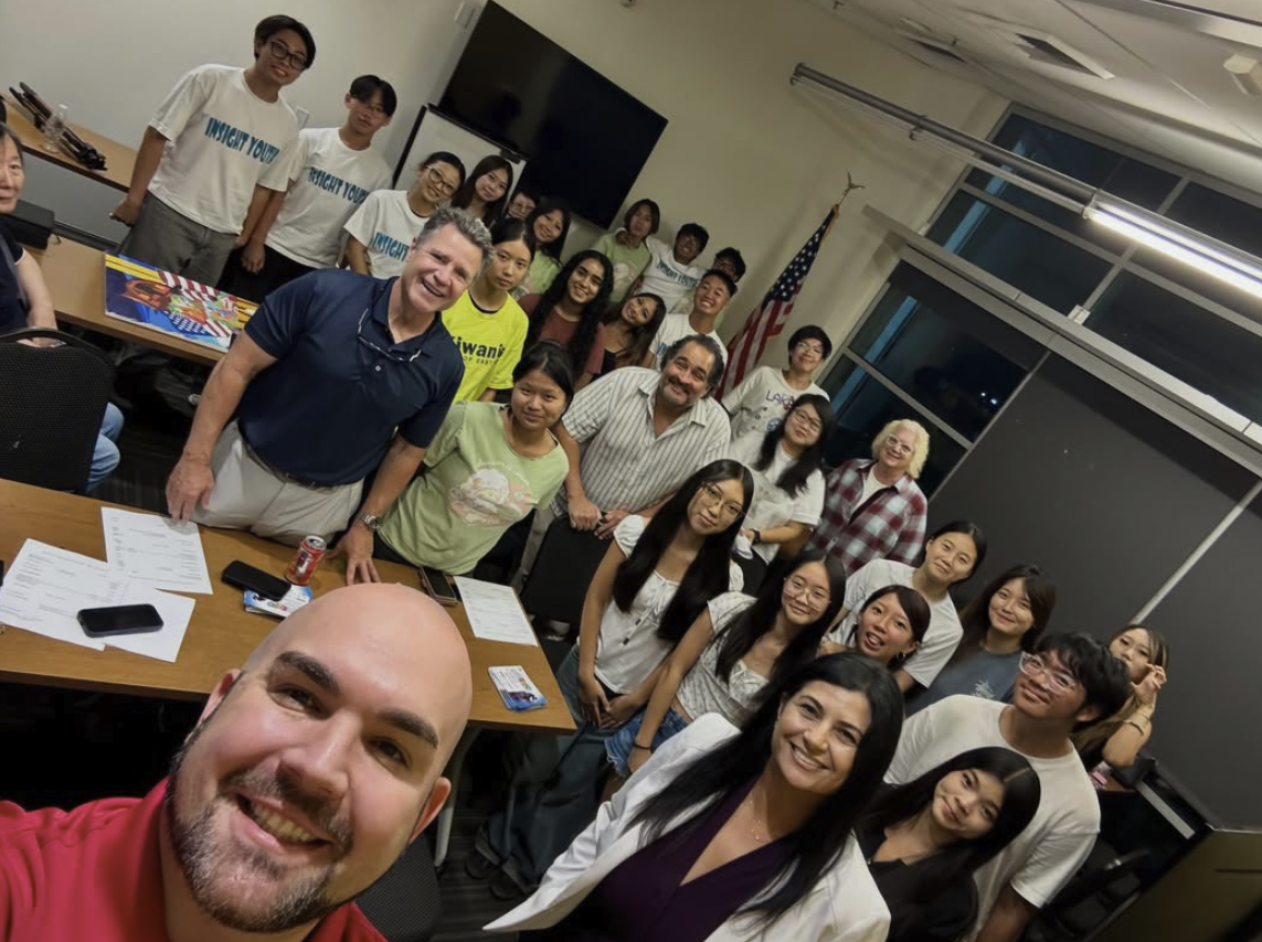 A group photo of Chris with Eastvale Kiwanis Club members and students.